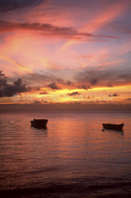 Sunset Island;fiji;colorful;yellow;sunset;sky;water;boat;pink;sillouettes;boat